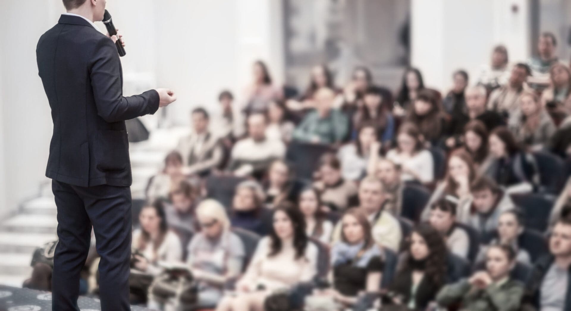 A man is giving a presentation to an audience.